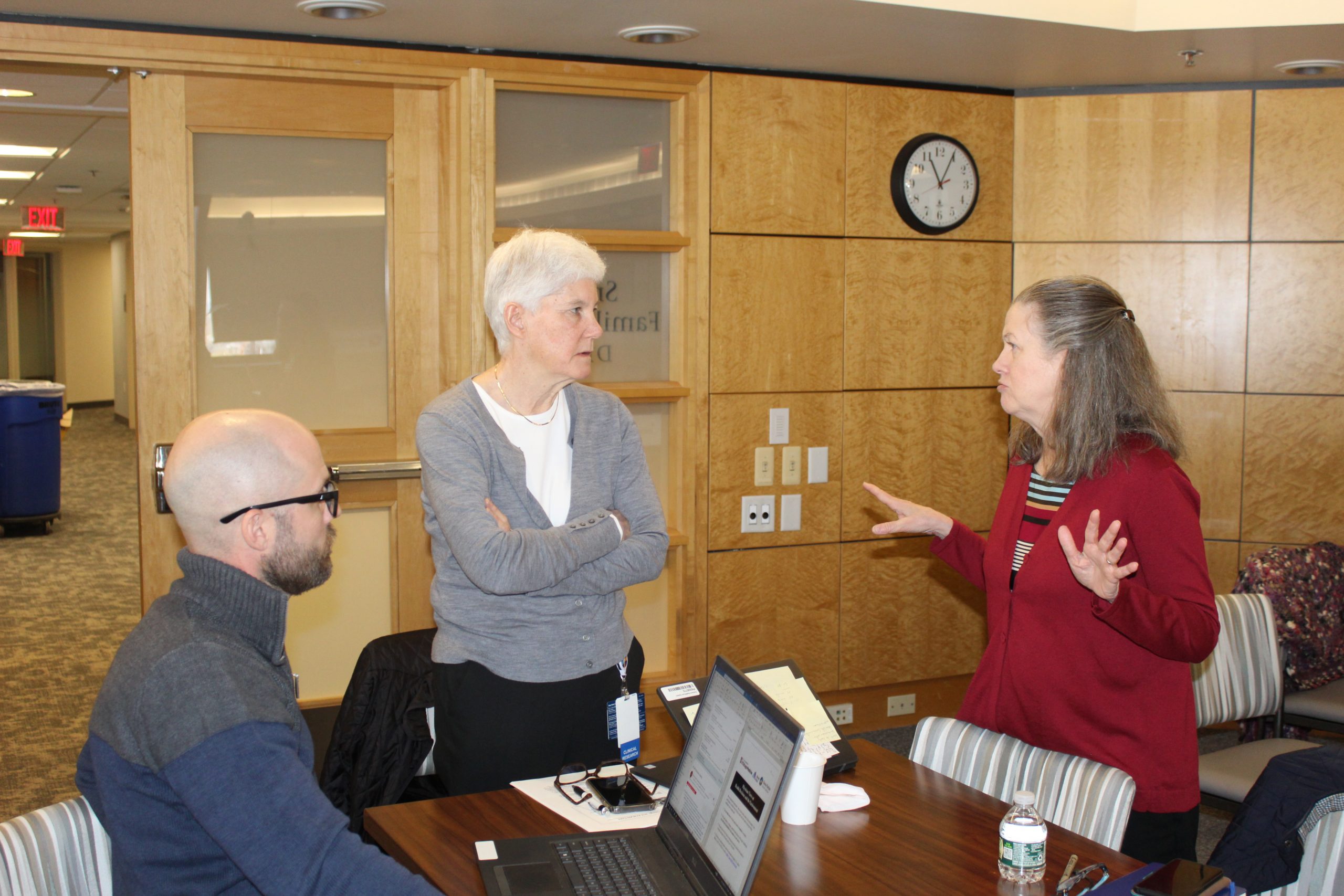 photo6 Three staff members talking