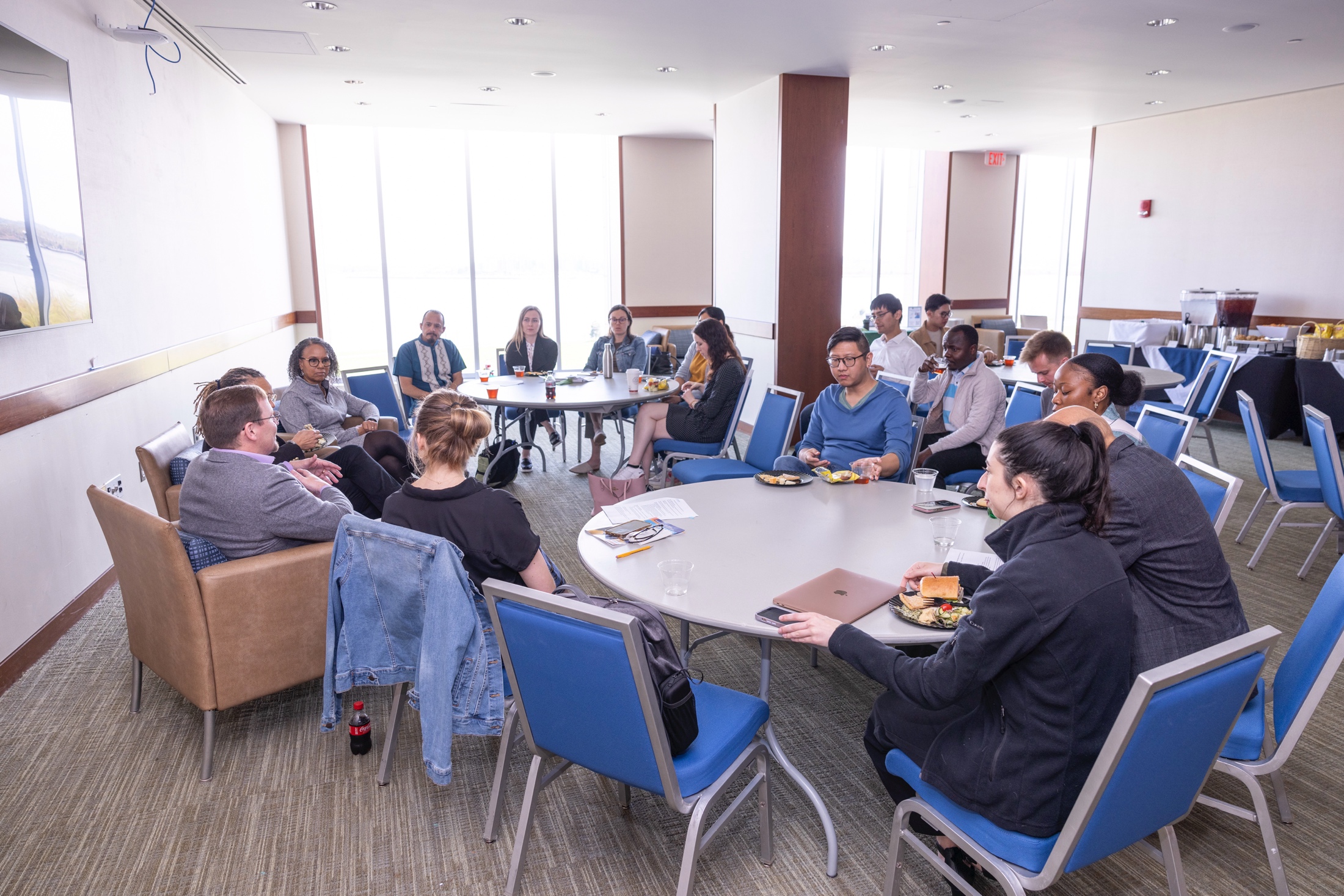 People sitting in a circle talking.